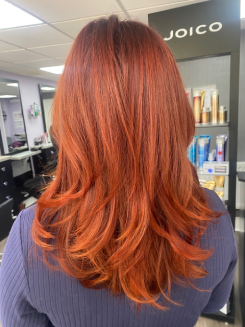 Vibrant copper and red hair colouring results created by the specialist team at Balayage Bognor Regis for a bold finish.