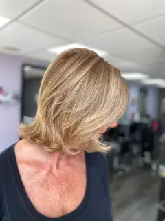 Natural honey blonde highlights with soft textured layers, styled by our Bognor Regis hair colour experts.