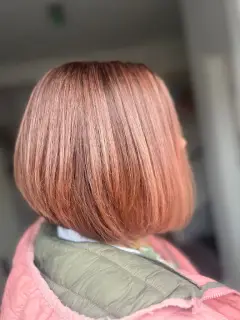 Soft rose gold blonde bob with subtle dimension, created by the professional colourists at our Bognor Regis salon.