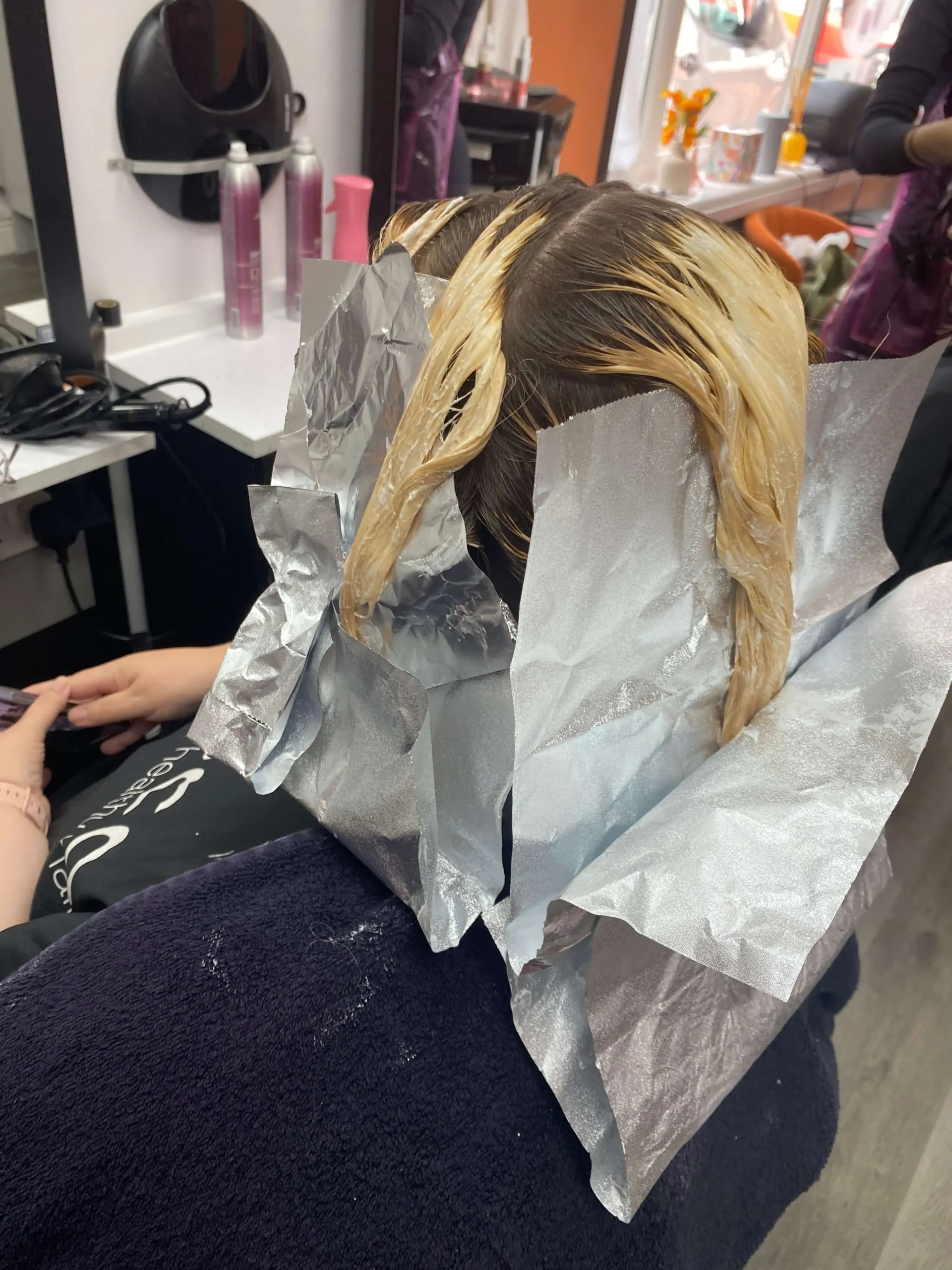 Lifting red pigment during a colour correction service in Bognor Regis.